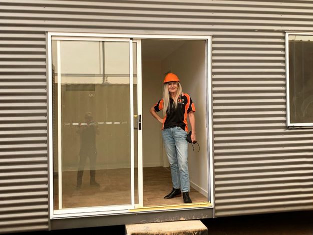 Melanie inspecting prefab Backyard Pods granny flat