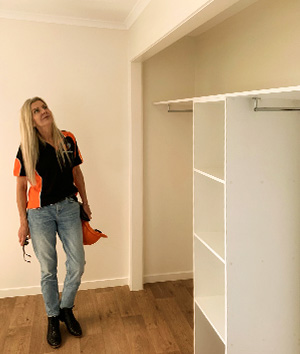 Melanie inspecting prefab Backyard Pods interior