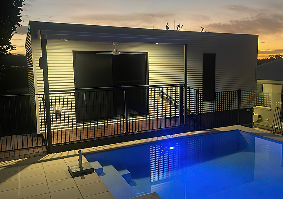 When it looks 'impossible' to build a granny flat, that's when you call Backyard Pods. Our customer in Bli Bli wanted a deluxe poolside granny flat that would hide a nightmare of tanks and plumbing underneath. With a custom design from our network architect, approval was gained for the standard 3.6m x 9m flatpack building kit to be cut down in size to 8.5m in length, gaining every available square metre available from this very compact site.